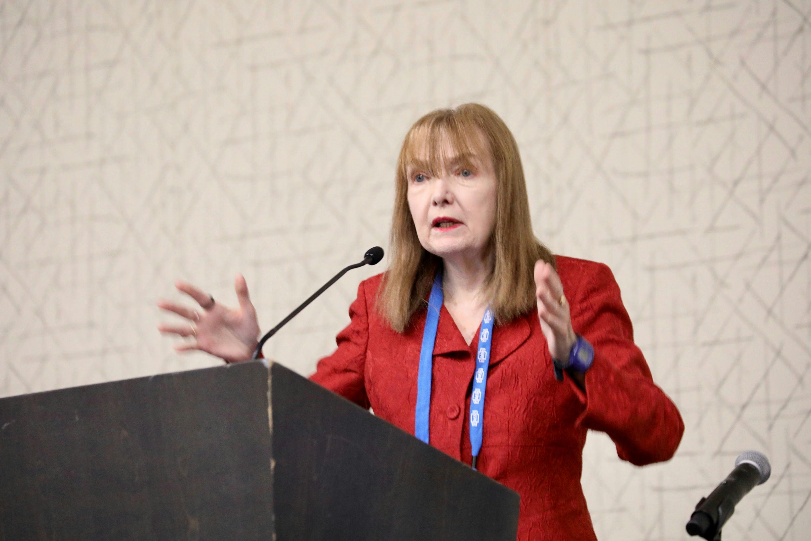 Patricia Coyle, MD, speaks to the room about COVID-19 and multiple sclerosis.
Image courtesy: Shmulik Almany