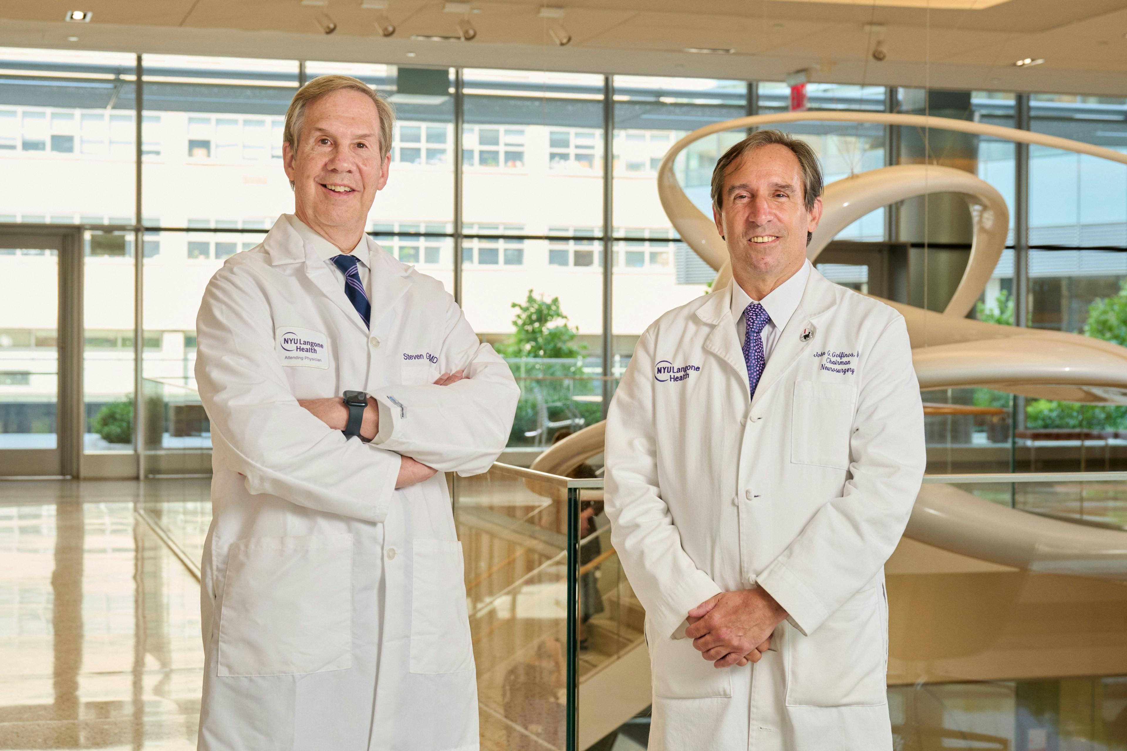Steven L. Galetta, MD (left), the Philip K. Moskowitz, MD Professor and Chair of Neurology, and John G. Golfinos, MD , the Joseph Ransohoff Professor of Neurosurgery and the chair of the Department of Neurosurgery, in the lobby of NYU Langone Health's Science Building on July 21, 2022, in Manhattan.